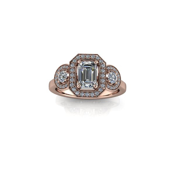 Emerald three stone halo engagement ring
